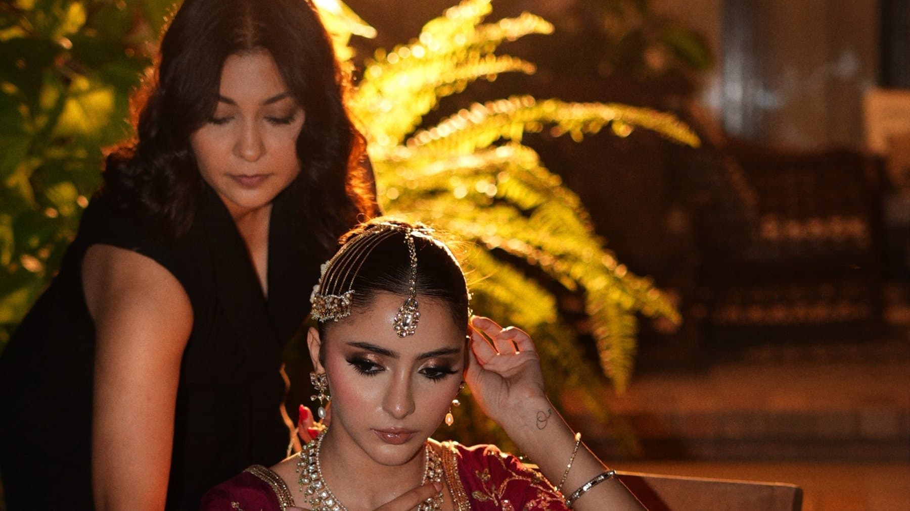 Shafaq setting a bride's headpiece before an evening event